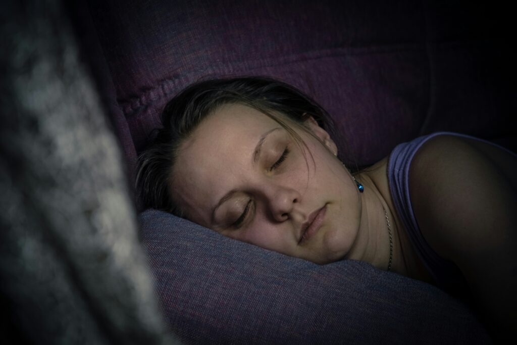 Sleep and Mental Health: The Connection Most People Underestimate Person resting peacefully in a softly lit bedroom, representing the restorative role of sleep in mental health.