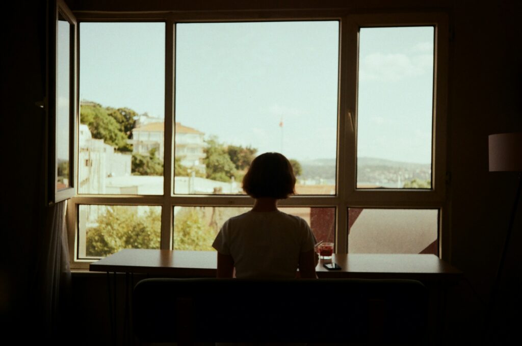 Emotional Dysregulation: When Your Emotions Feel Too Big to Manage Adult siting quietly, the internal experience of emotional dysregulation.