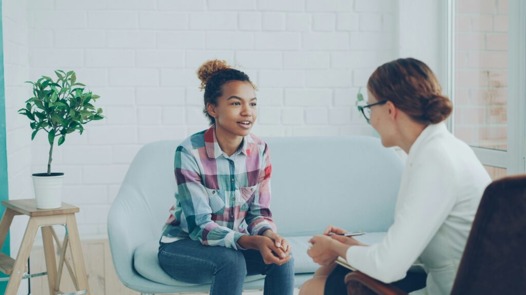 Therapist vs. Psychiatric Provider: What's the Difference? A patient and her mental health provider