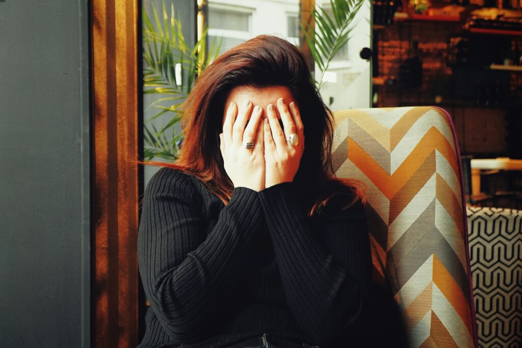 Grief After Divorce or a Major Breakup: Why It Hurts This Much This image shows woman sittting alone - sadness, grief.