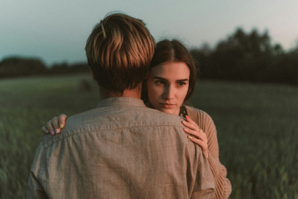 man and woman hugging