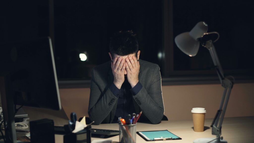 Chronic Stress: What It's Actually Doing to Your Body and Brain Adult with an expression of prolonged exhaustion, representing the experience of chronic stress.