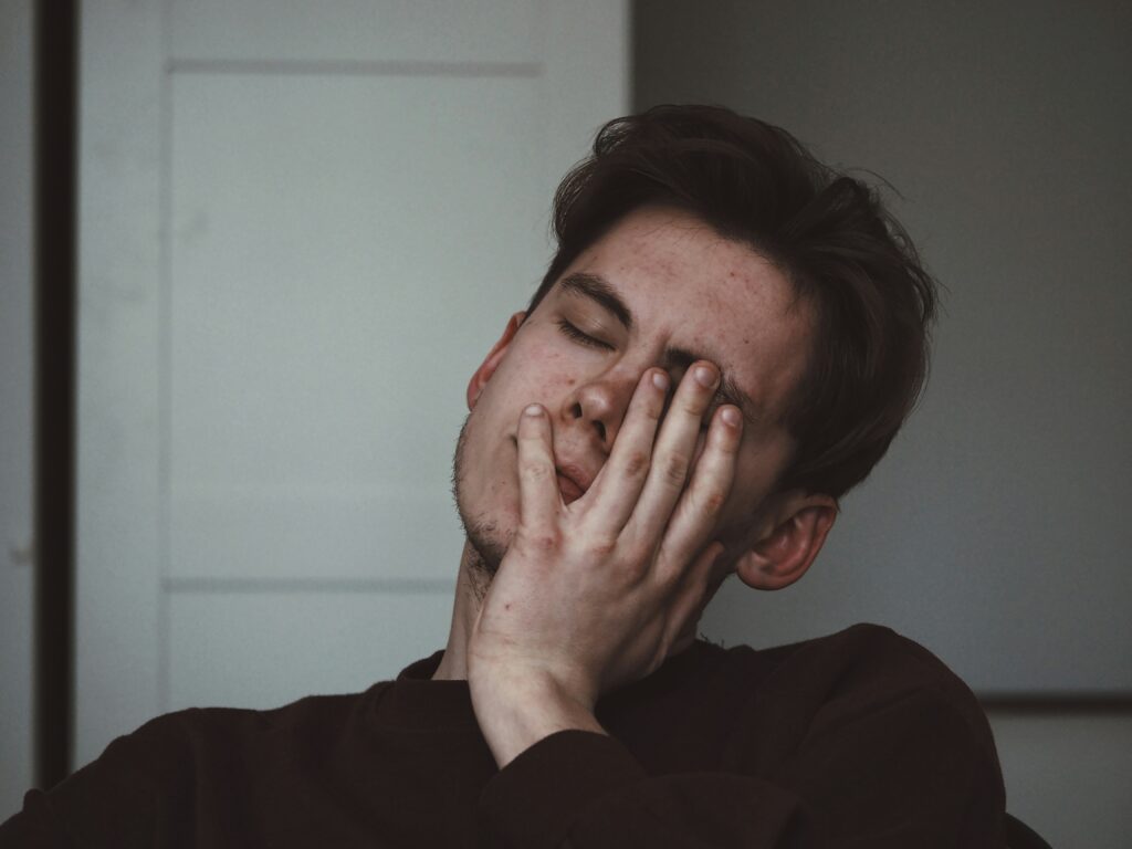 Man with a quietly tense expression, showing anxiety