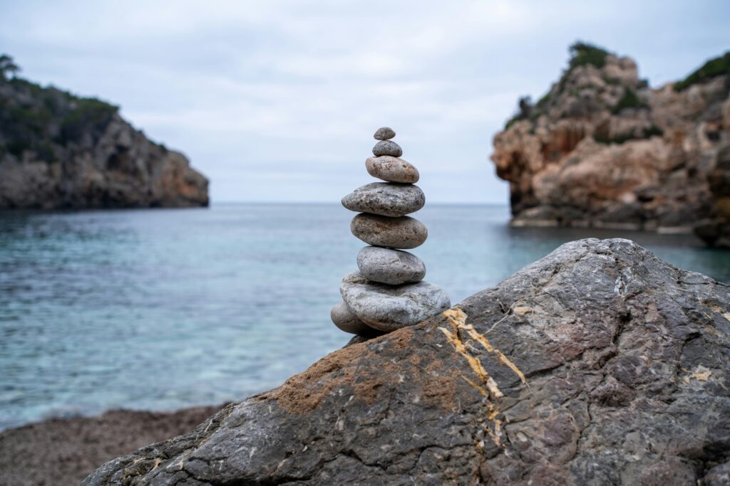 Health Anxiety in 2026: When Googling Symptoms Makes Everything Worse Stacking stones for meditation